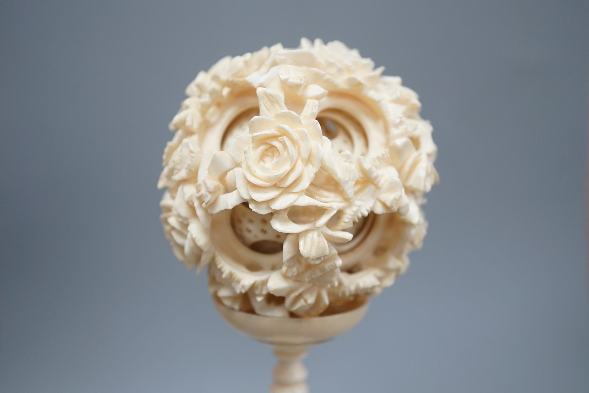 An early 20th century Chinese ivory concentric puzzle ball and stand 20cm total height